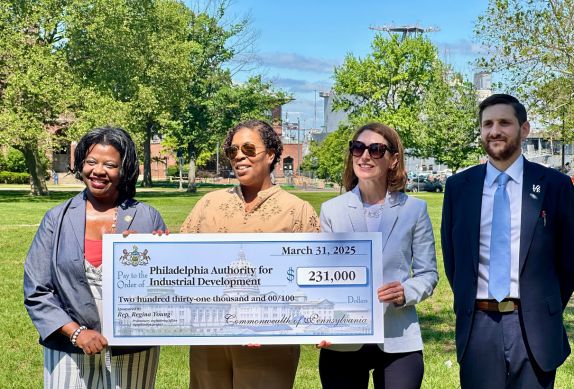 Image of people holding a check