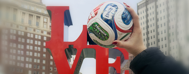 Image of love statue and soccer ball.